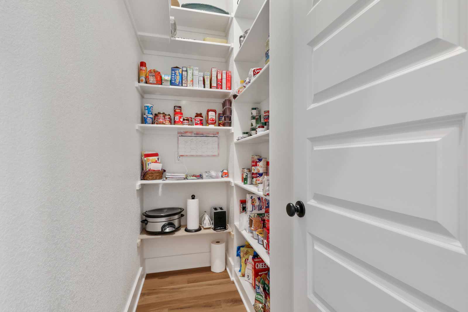 Walk-in pantry in Kenneth Estates home