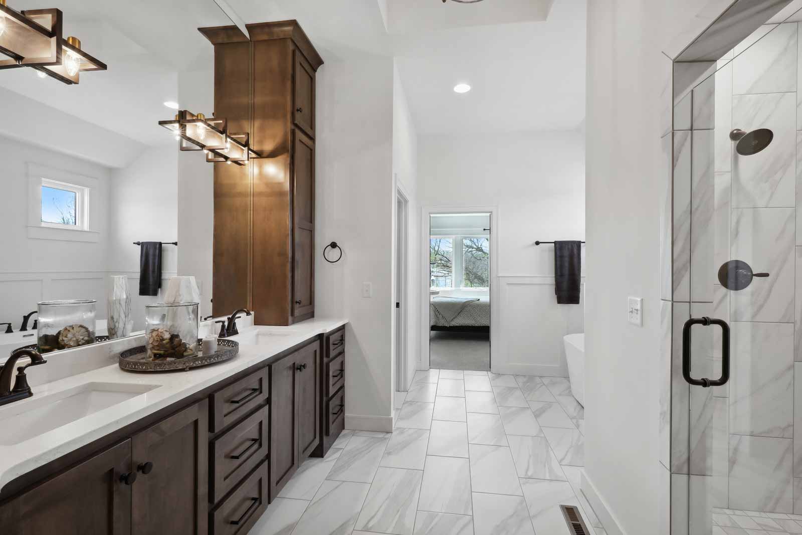 Master bathroom with double vanity and walk in shower