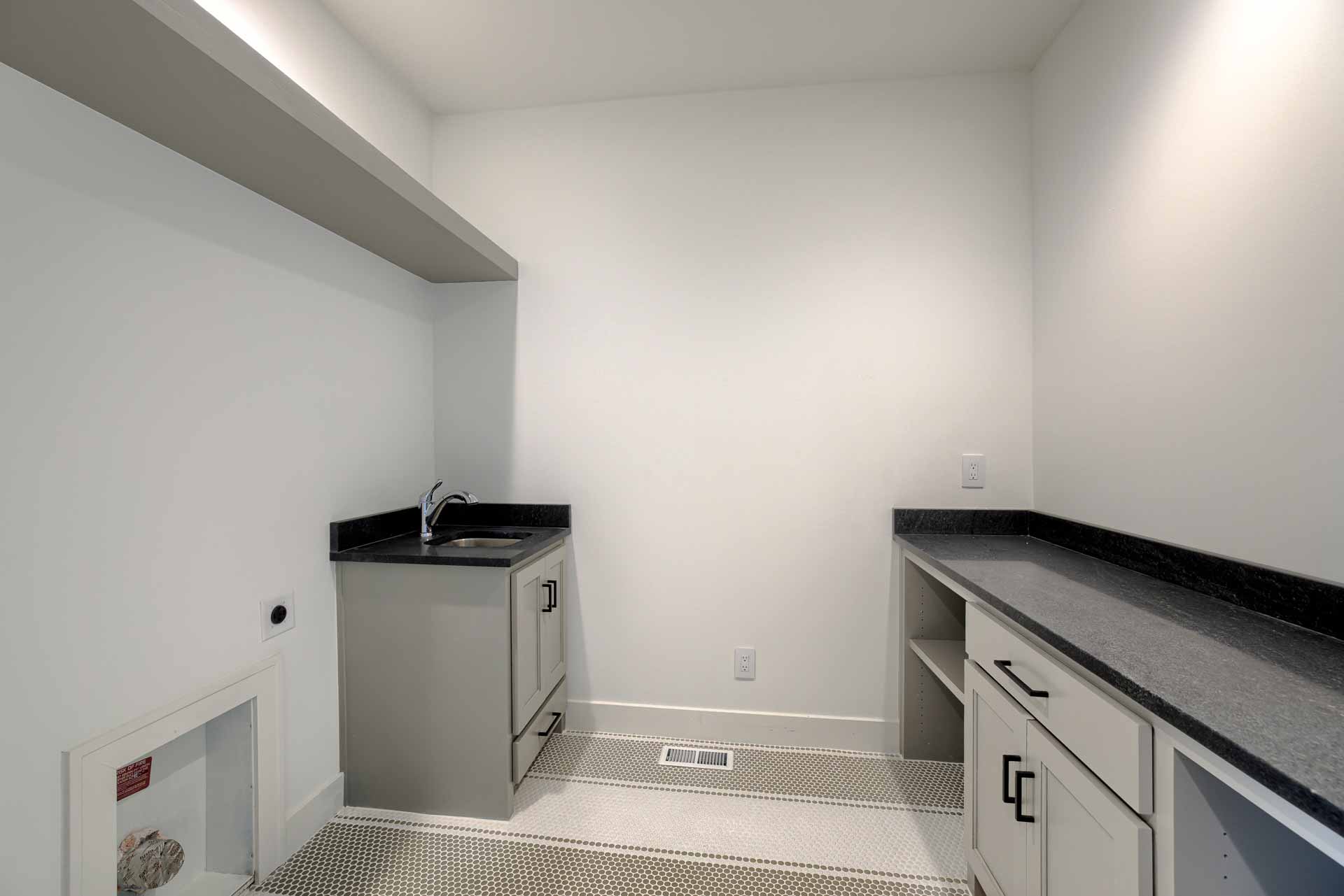 Laundry room in Kenneth Estates home