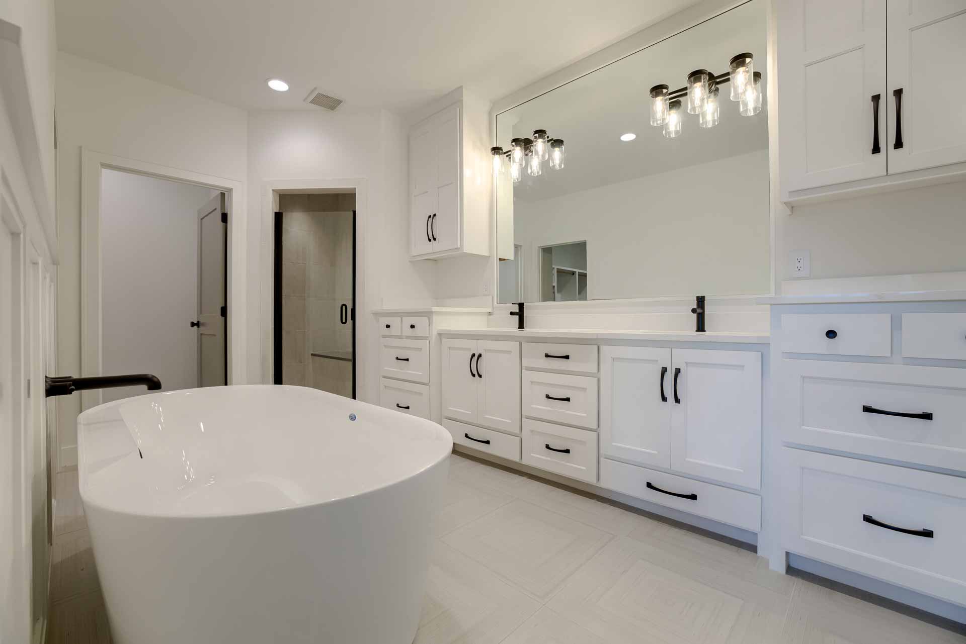 Master bathroom with double vanity and large tub